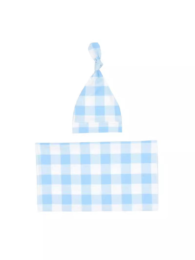 Blue gingham swaddle blanket with matching knotted newborn hat