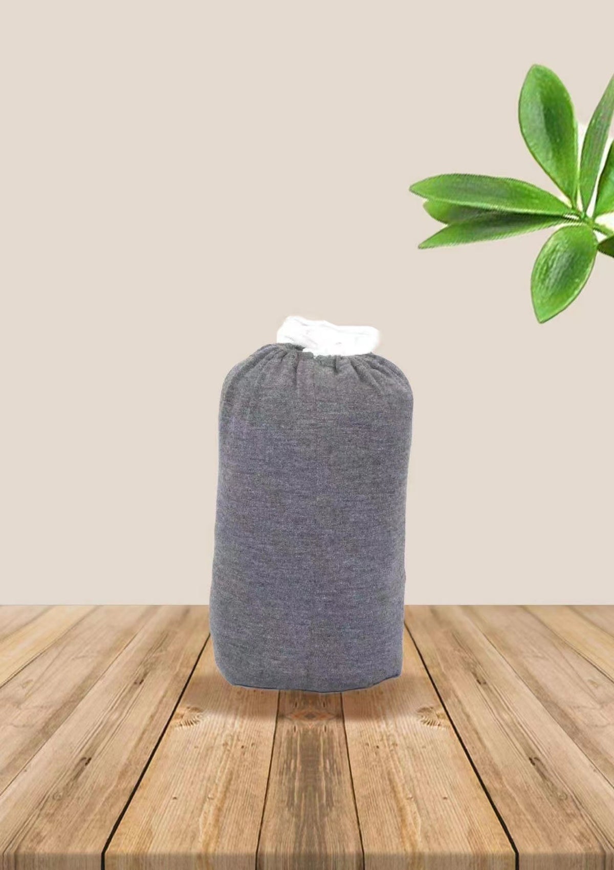 Baby wrap carrier in Dark Grey, rolled up for storage