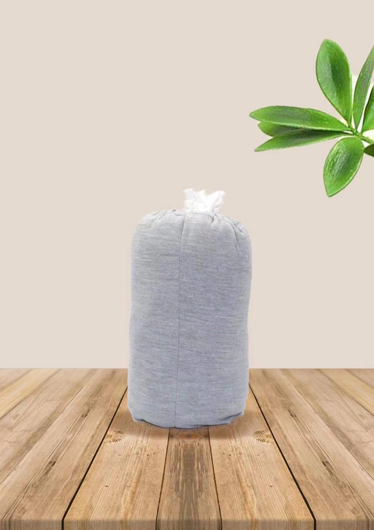 Baby wrap carrier in Light Grey, rolled up for storage