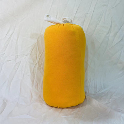 Baby wrap carrier in Yellow, rolled up for storage