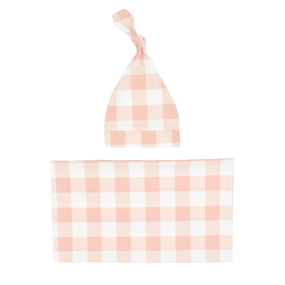 Newborn swaddle blanket and knotted hat set in peach gingham